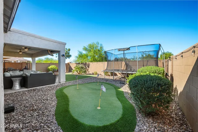 a swimming pool with barbeque oven