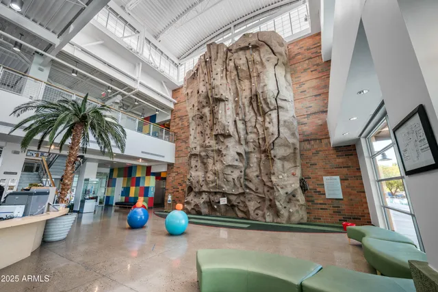 a group of people sitting in front of a building