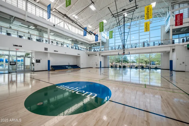 a view of a swimming pool with outdoor seating
