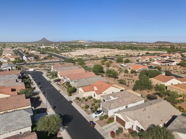 an aerial view of residential building and lake