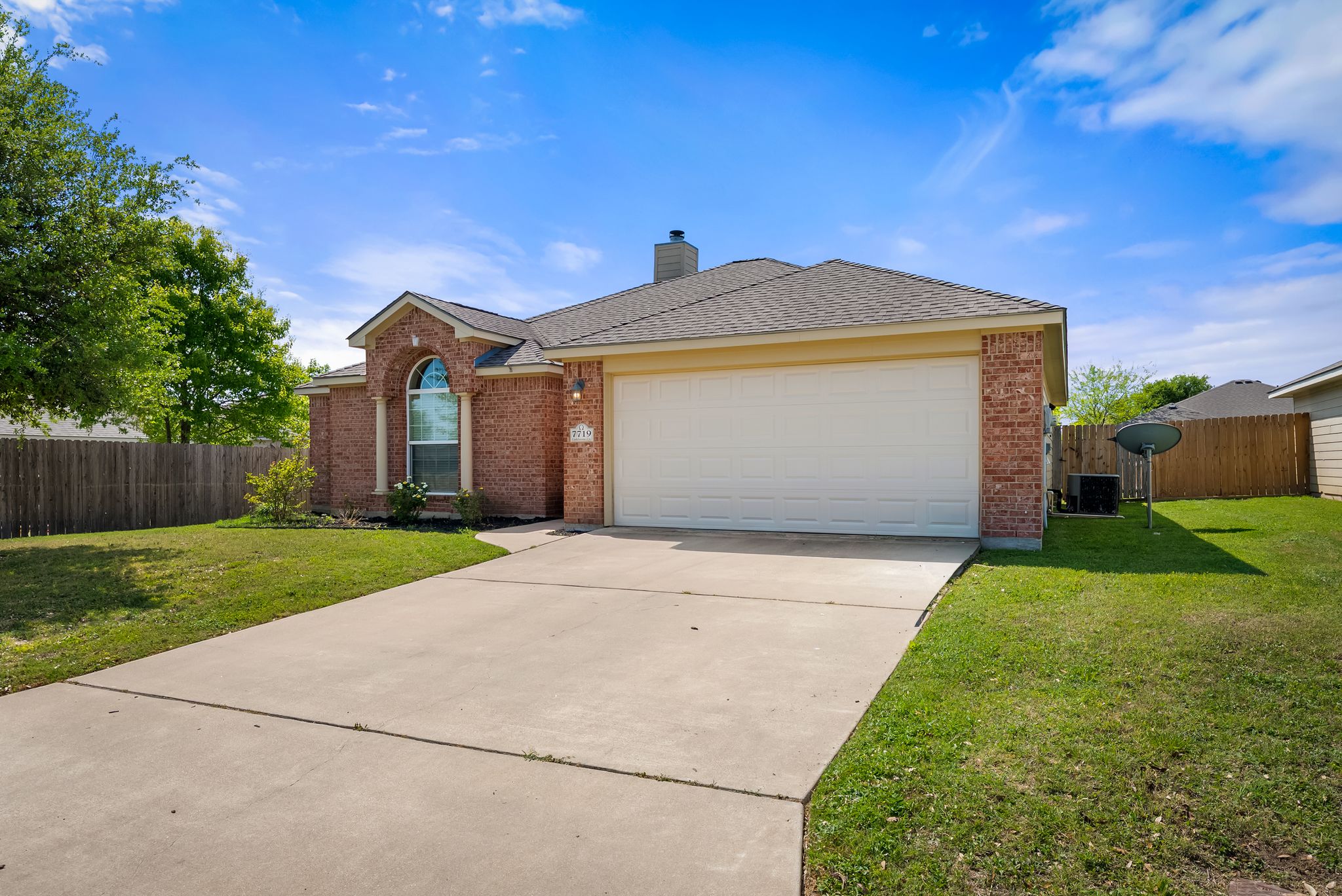 7719 Fieldstone Drive Temple, TX 76502 - Photo 1 of 37 View of front of property with brick siding, a garage, driveway, a chimney, and a shingled roof