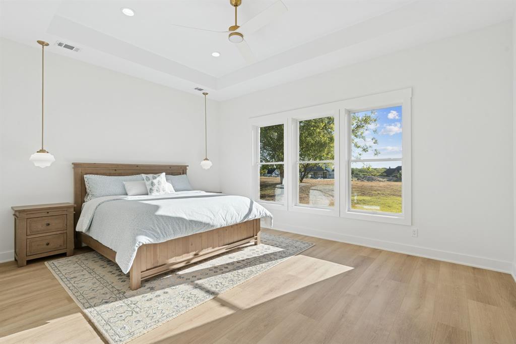 8008 Ben Day Murrin Road Fort Worth, TX 76126 - Photo 15 of 40 a bedroom with a large bed and a window