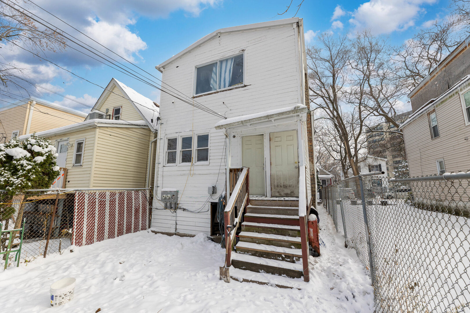 6124 South Sangamon Street Chicago, IL 60621 - Photo 15 of 17 a view of a house with wooden fence