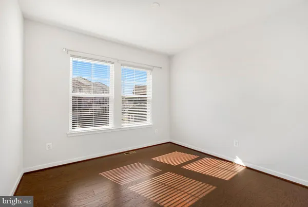 a room with a bed and a window