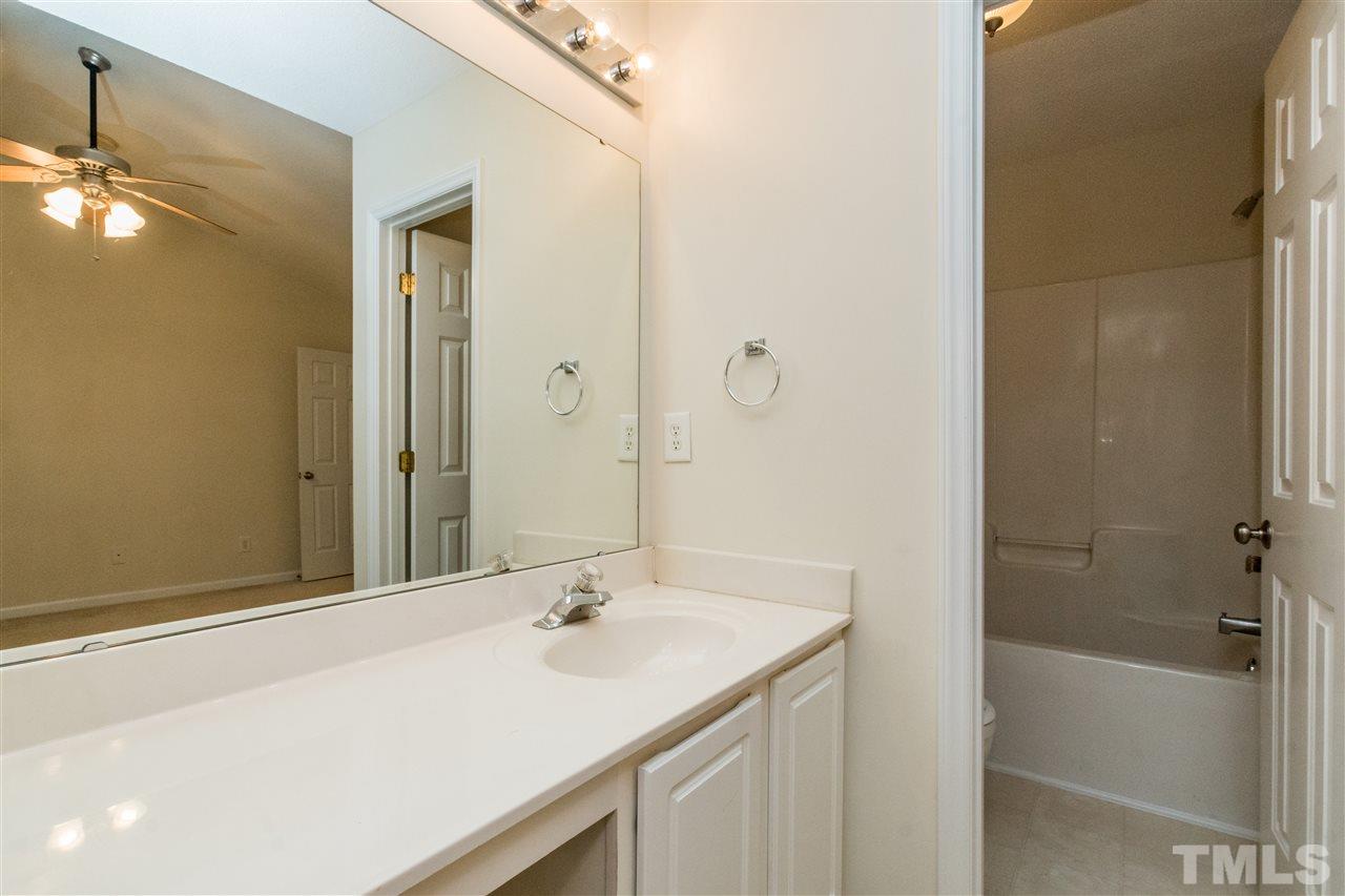 118 Setter Point Clayton, NC 27520 - Photo 14 of 21 a bathroom with a sink double vanity mirror and a bathtub