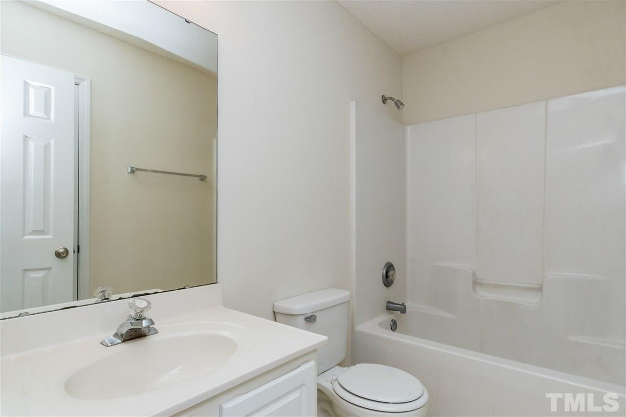 118 Setter Point Clayton, NC 27520 - Photo 16 of 21 a bathroom with a sink toilet and shower