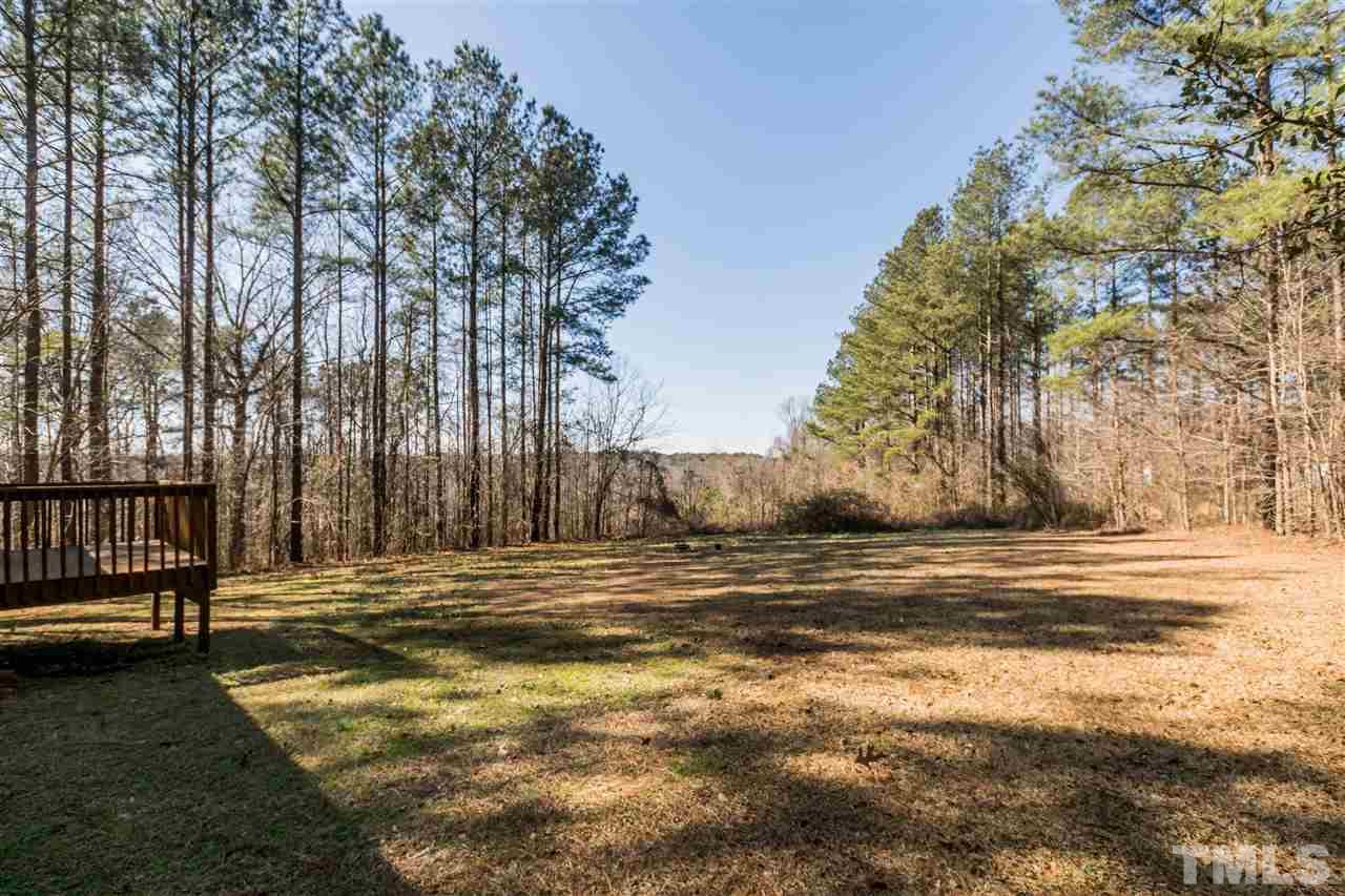 118 Setter Point Clayton, NC 27520 - Photo 19 of 21 a view of a yard with large trees