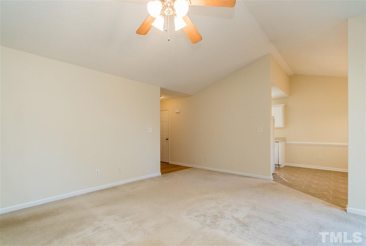 118 Setter Point Clayton, NC 27520 - Photo 6 of 21 an empty room with a chandelier fan