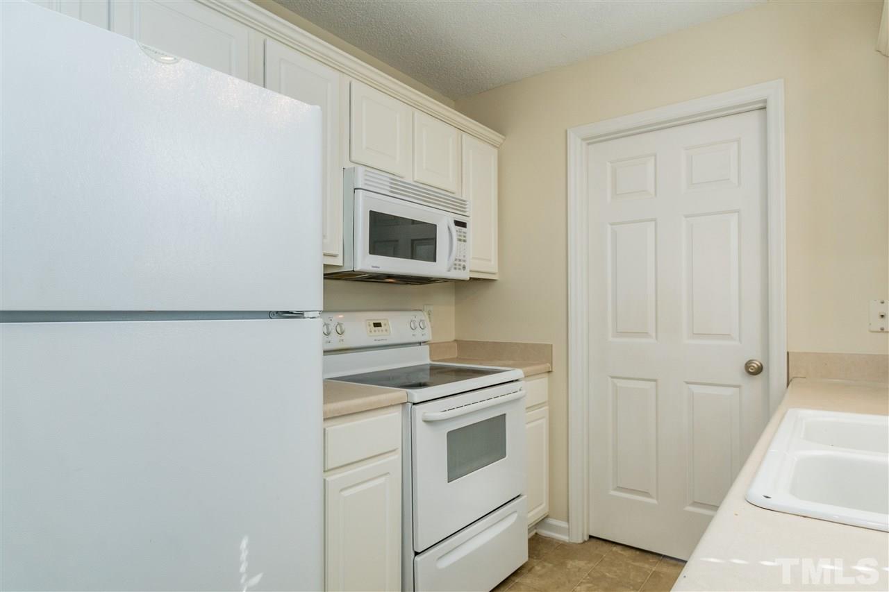 118 Setter Point Clayton, NC 27520 - Photo 8 of 21 a kitchen with a stove microwave and sink