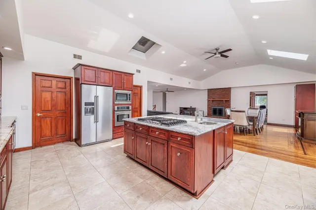 an aerial view of residential houses with outdoor space and trees