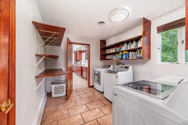 a living room with furniture windows and a flat screen tv
