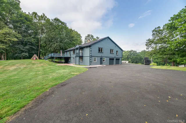 a view of a kitchen with wooden floor and a sink
