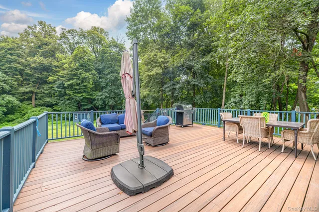 a view of a deck with a table and chairs with wooden floor