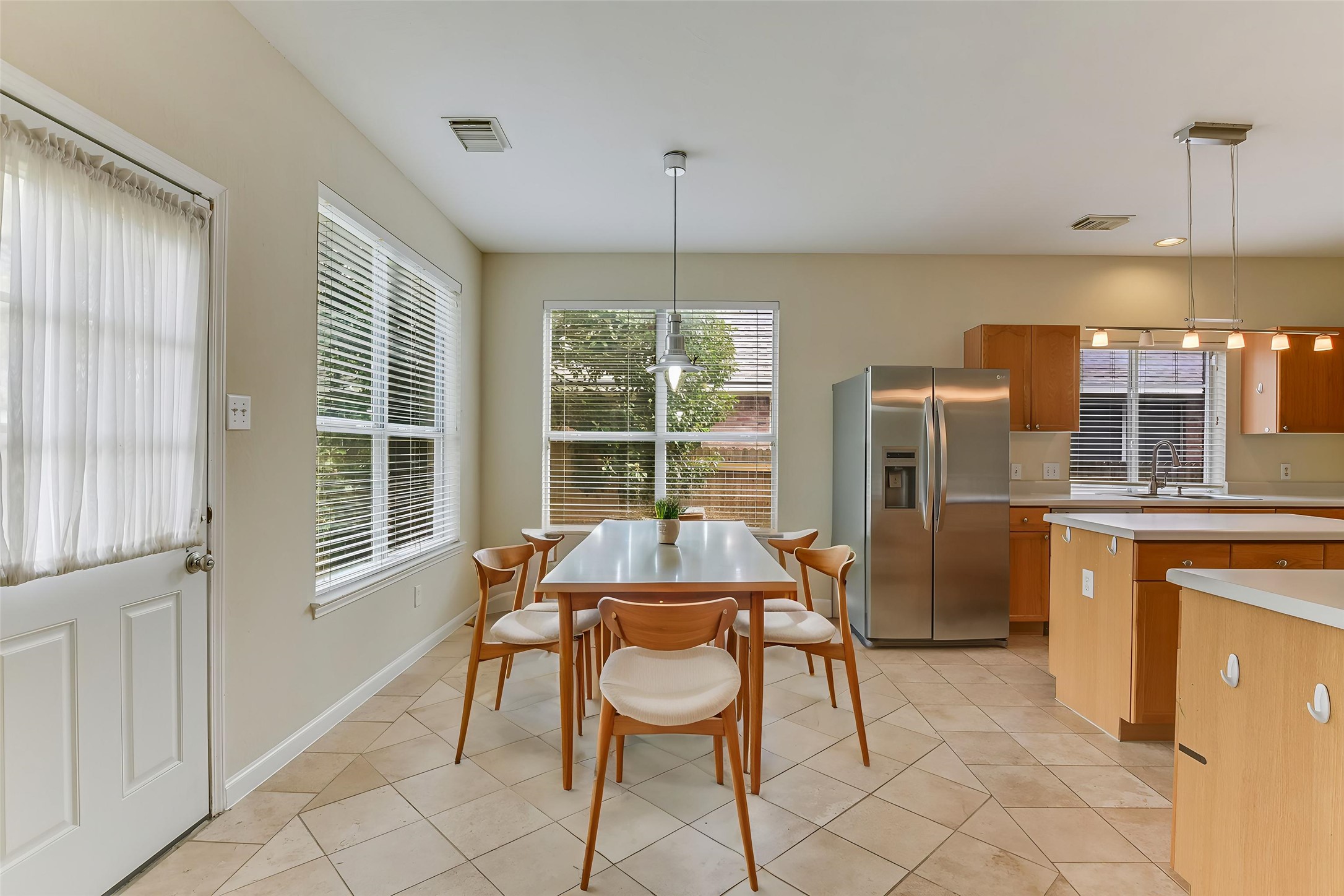 2218 Equestrian Trail Austin, TX 78727 - Photo 17 of 39 Virtually Staged: Dining space with light tile patterned flooring and baseboards