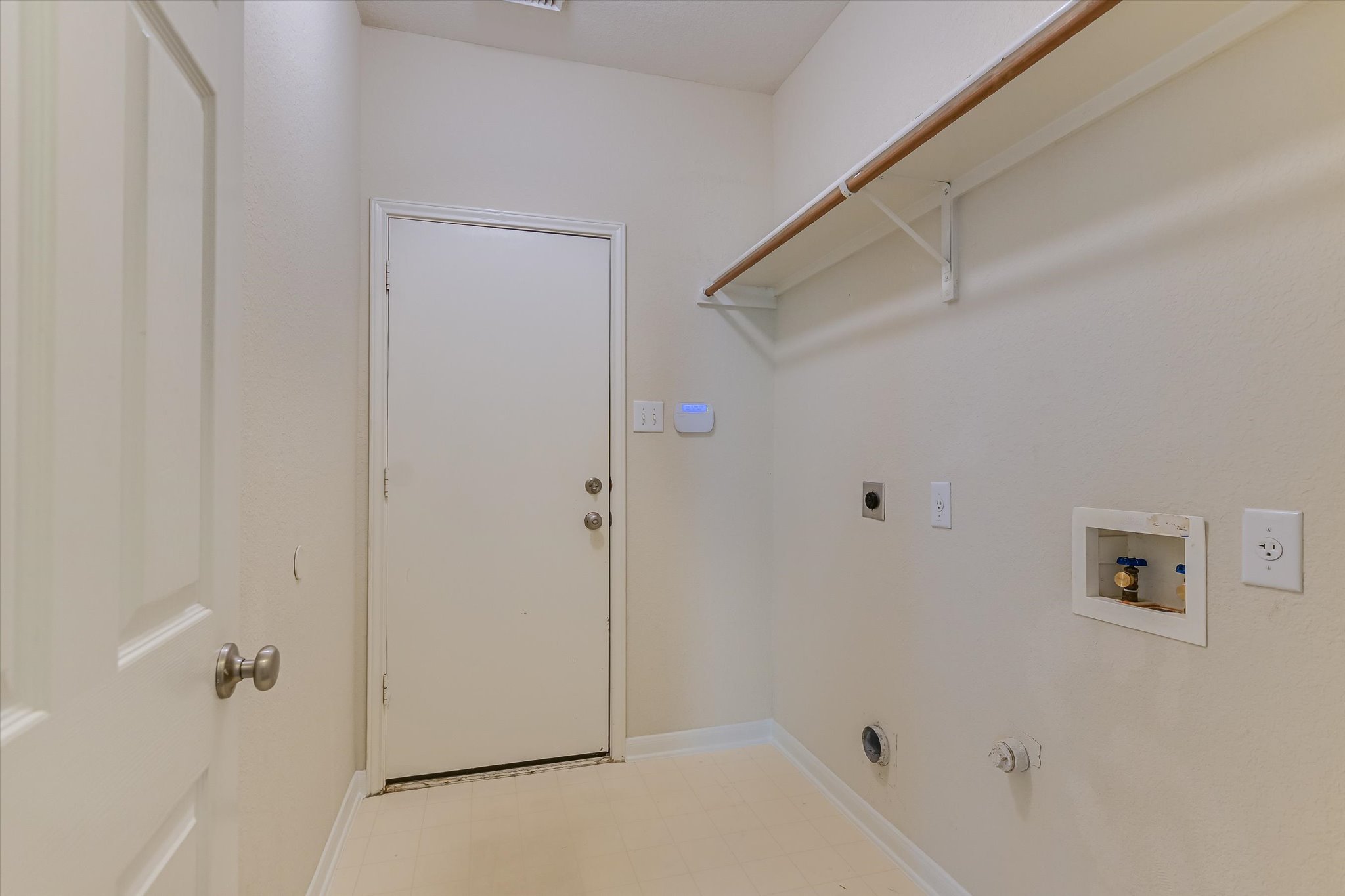 2218 Equestrian Trail Austin, TX 78727 - Photo 20 of 39 Laundry area featuring hookup for an electric dryer, gas dryer hookup, washer hookup, and light floors