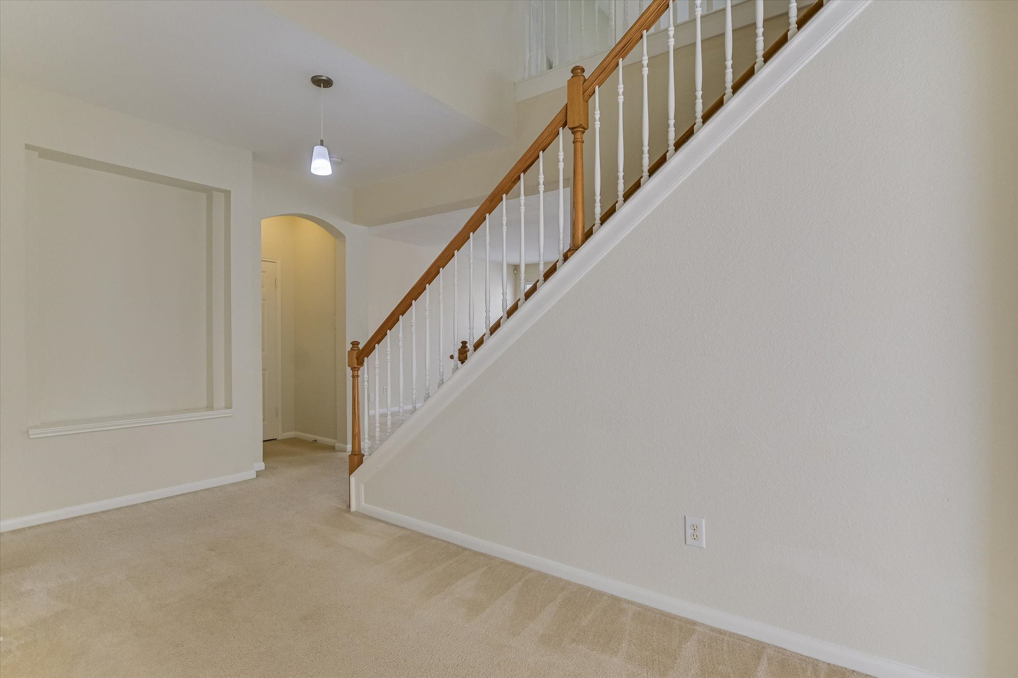 2218 Equestrian Trail Austin, TX 78727 - Photo 21 of 39 Stairway with arched walkways and carpet flooring