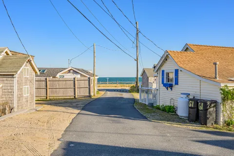 a view of front of house with a yard