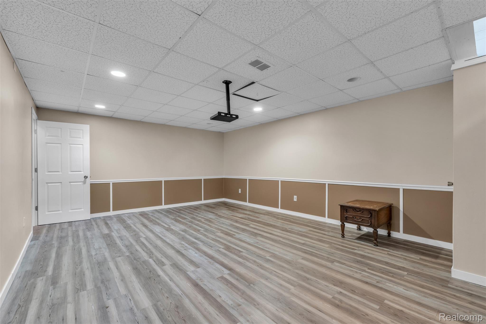 1345 Ives Road Mason, MI 48854 - Photo 39 of 92 Unfurnished room with a drop ceiling, light wood-style floors, and recessed lighting