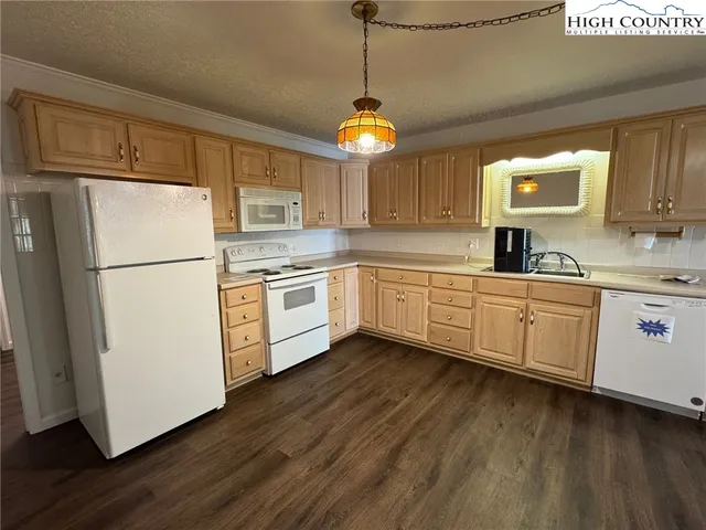 a view of a kitchen with a sink
