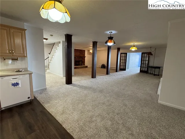 a bathroom with a toilet sink and a mirror