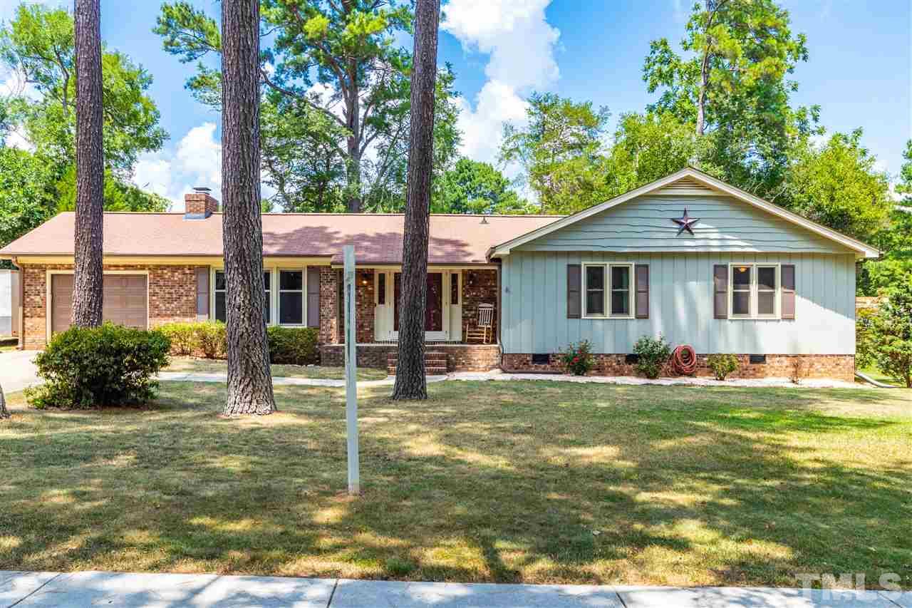 2021 Port Royal Road Raleigh, NC 27609 - Photo 1 of 23 a front view of a house with a yard