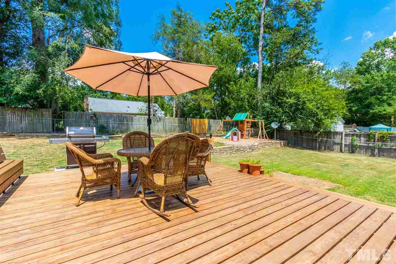 2021 Port Royal Road Raleigh, NC 27609 - Photo 2 of 23 an outdoor space with furniture and umbrella