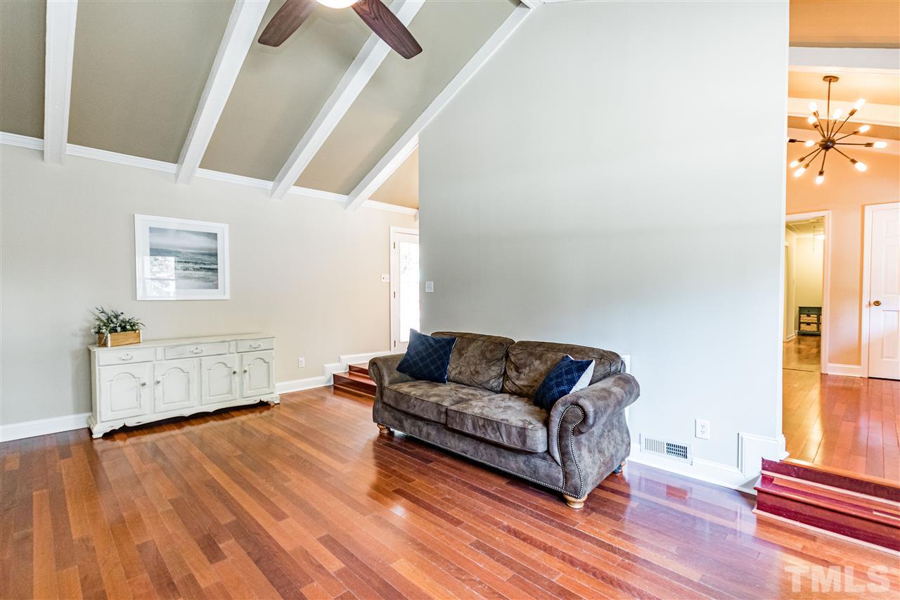 2021 Port Royal Road Raleigh, NC 27609 - Photo 12 of 23 a living room with furniture and a wooden floor