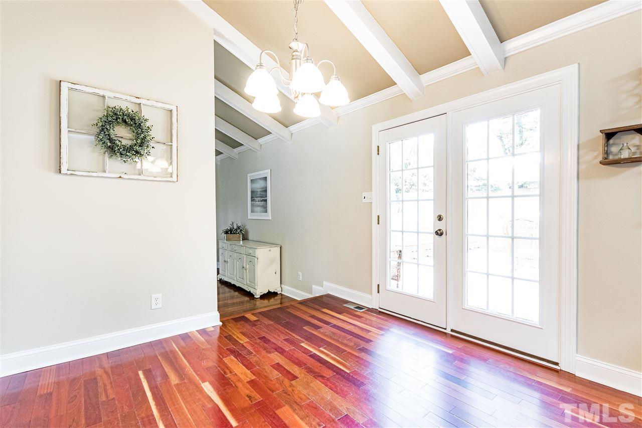 2021 Port Royal Road Raleigh, NC 27609 - Photo 13 of 23 a view of an empty room with wooden floor and a window