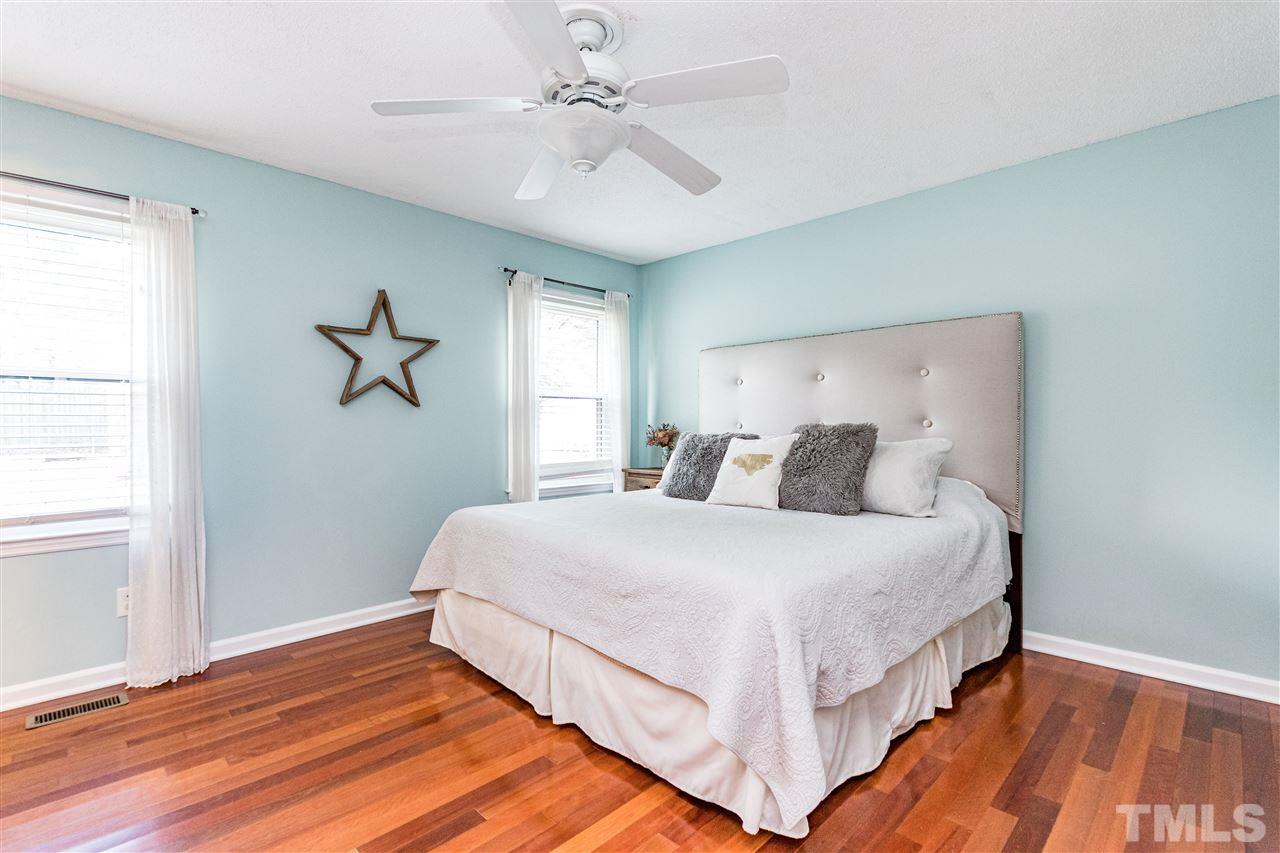 2021 Port Royal Road Raleigh, NC 27609 - Photo 18 of 23 a bedroom with bed and window