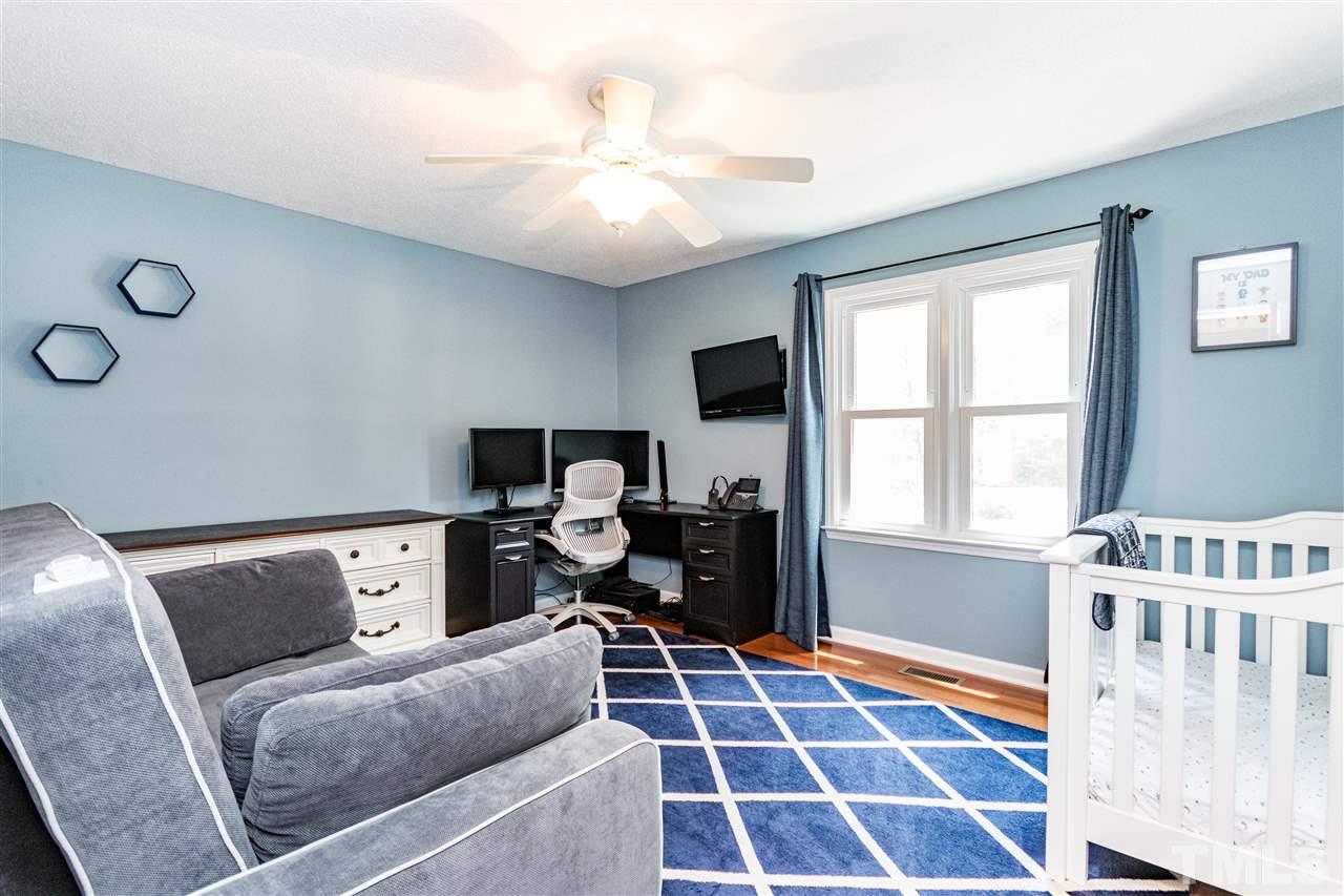 2021 Port Royal Road Raleigh, NC 27609 - Photo 20 of 23 a living room with furniture and a rug
