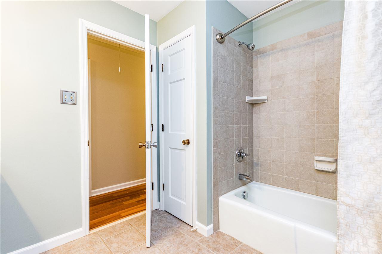2021 Port Royal Road Raleigh, NC 27609 - Photo 22 of 23 a bathroom with a bathtub and a shower