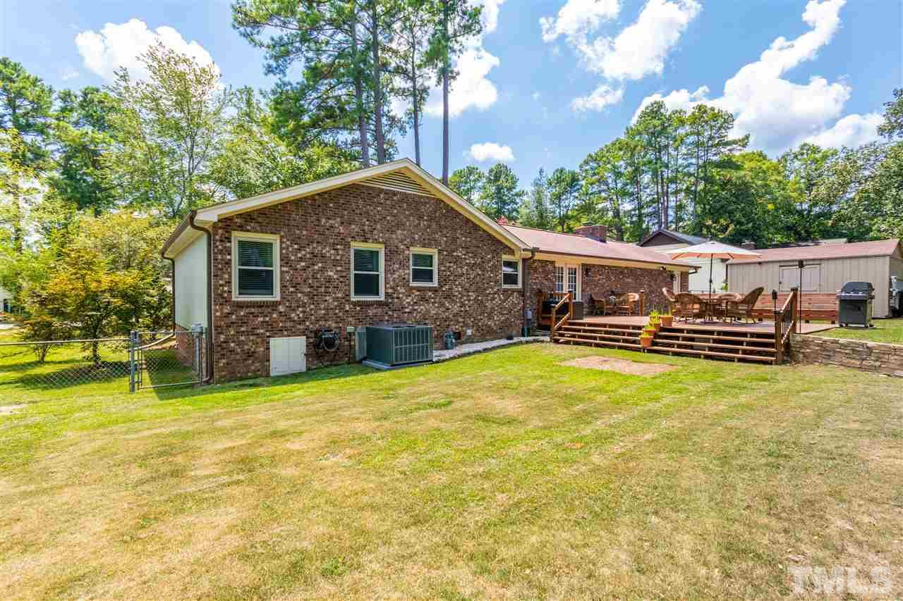 2021 Port Royal Road Raleigh, NC 27609 - Photo 6 of 23 a view of a house with pool and chairs