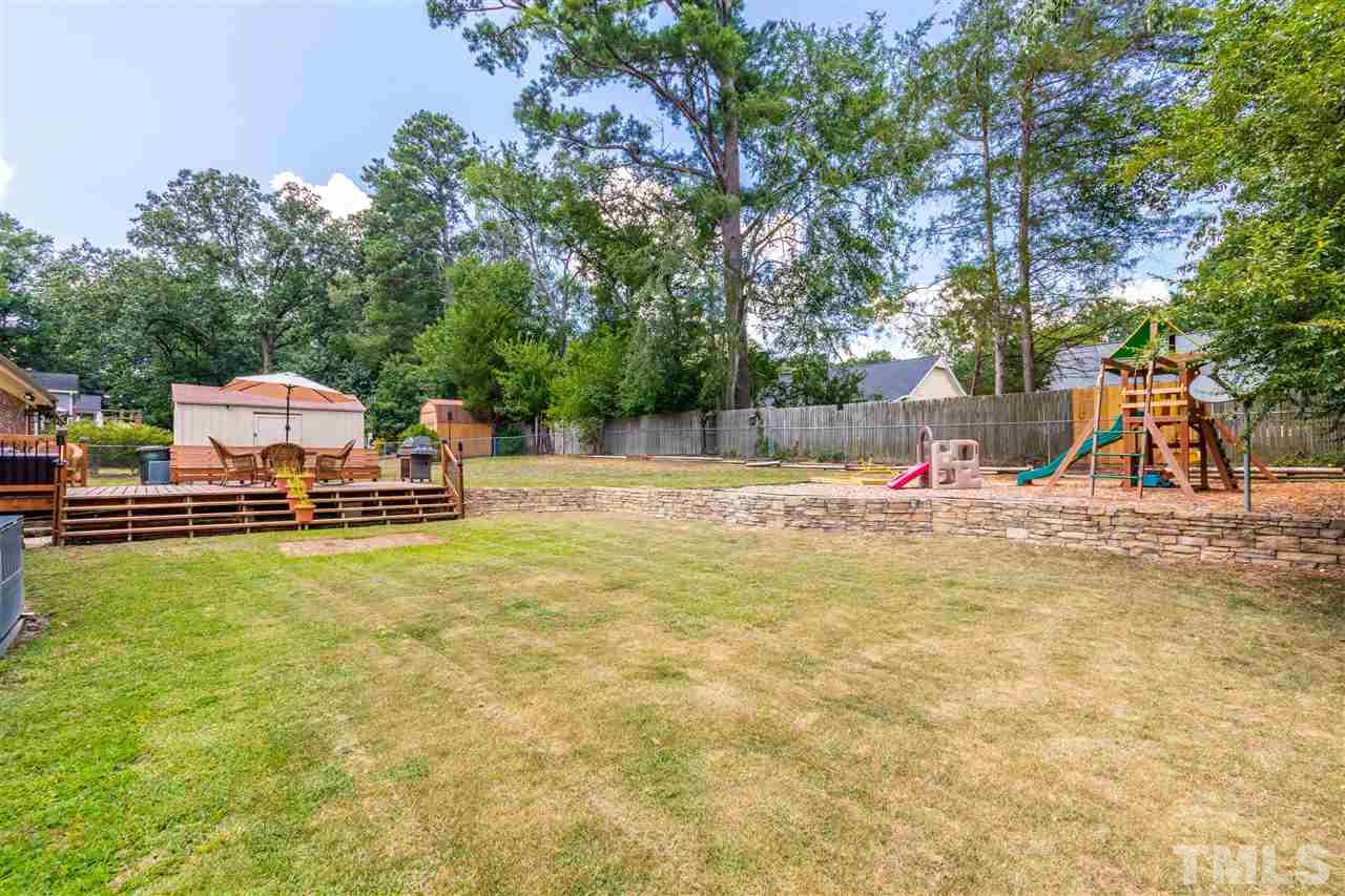 2021 Port Royal Road Raleigh, NC 27609 - Photo 7 of 23 a view of a swimming pool with a slide