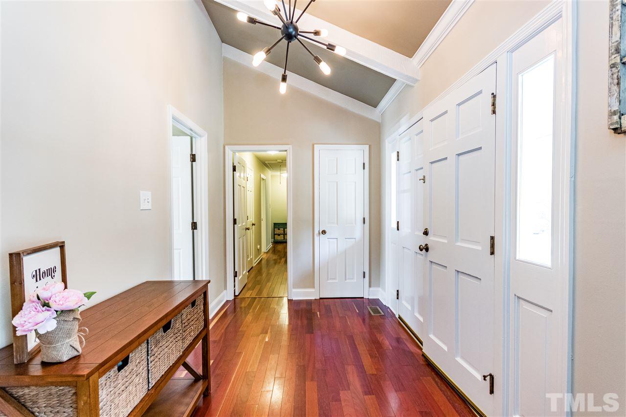2021 Port Royal Road Raleigh, NC 27609 - Photo 8 of 23 a very nice looking room with wooden floor and a bathroom