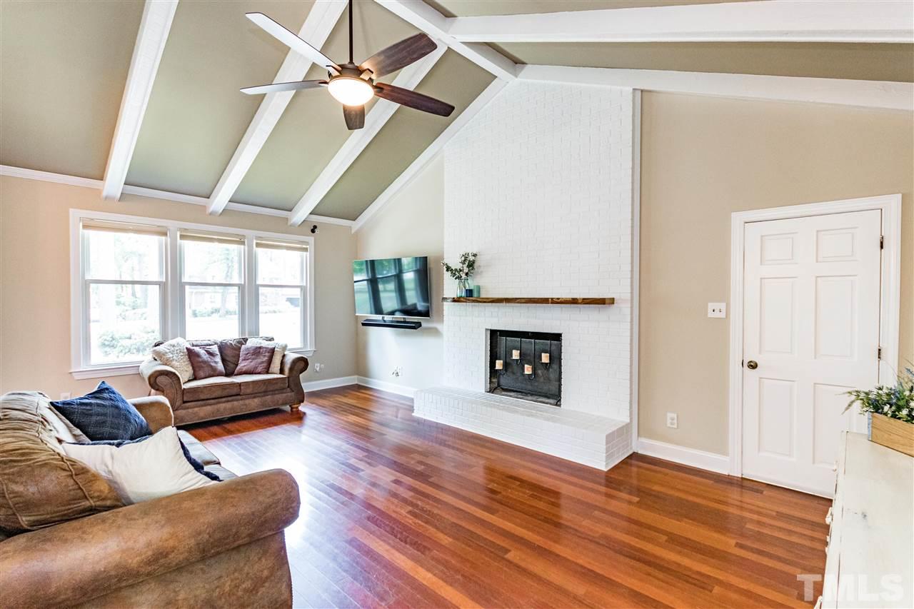 2021 Port Royal Road Raleigh, NC 27609 - Photo 9 of 23 a living room with furniture and a fireplace