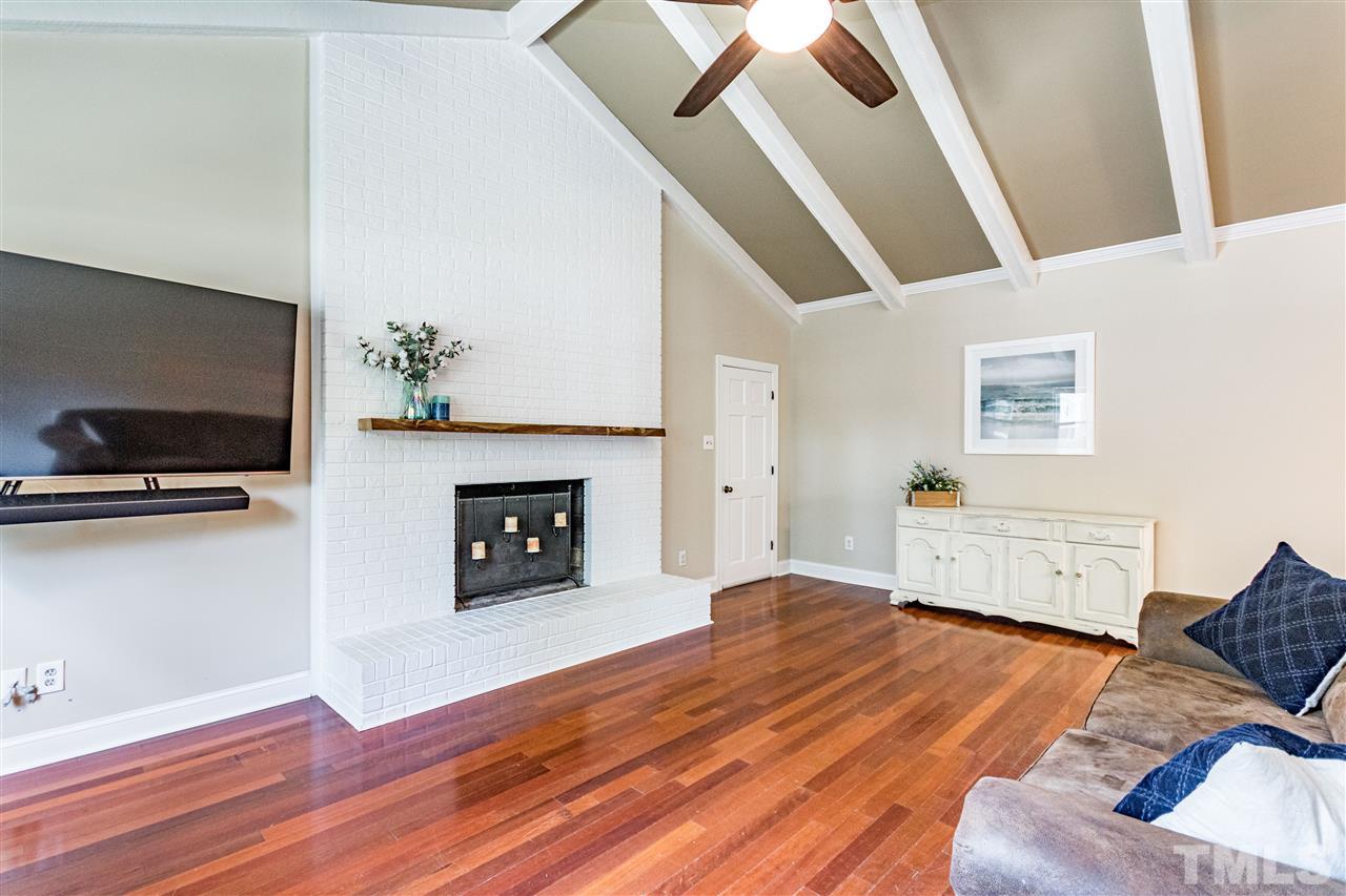 2021 Port Royal Road Raleigh, NC 27609 - Photo 10 of 23 a living room with furniture and a fireplace