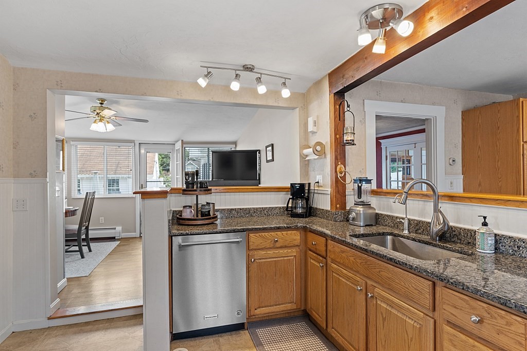 8 Perham Street Chelmsford, MA 01824 - Photo 12 of 42 a kitchen with white cabinets and sink