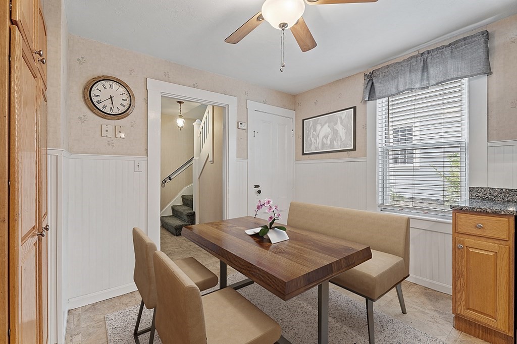 8 Perham Street Chelmsford, MA 01824 - Photo 14 of 42 a view of a dining room with furniture and a chandelier