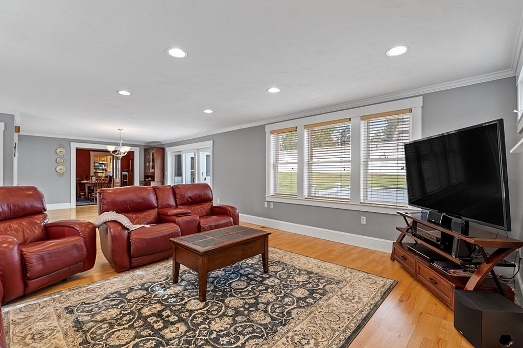 8 Perham Street Chelmsford, MA 01824 - Photo 18 of 42 a living room with furniture and a flat screen tv
