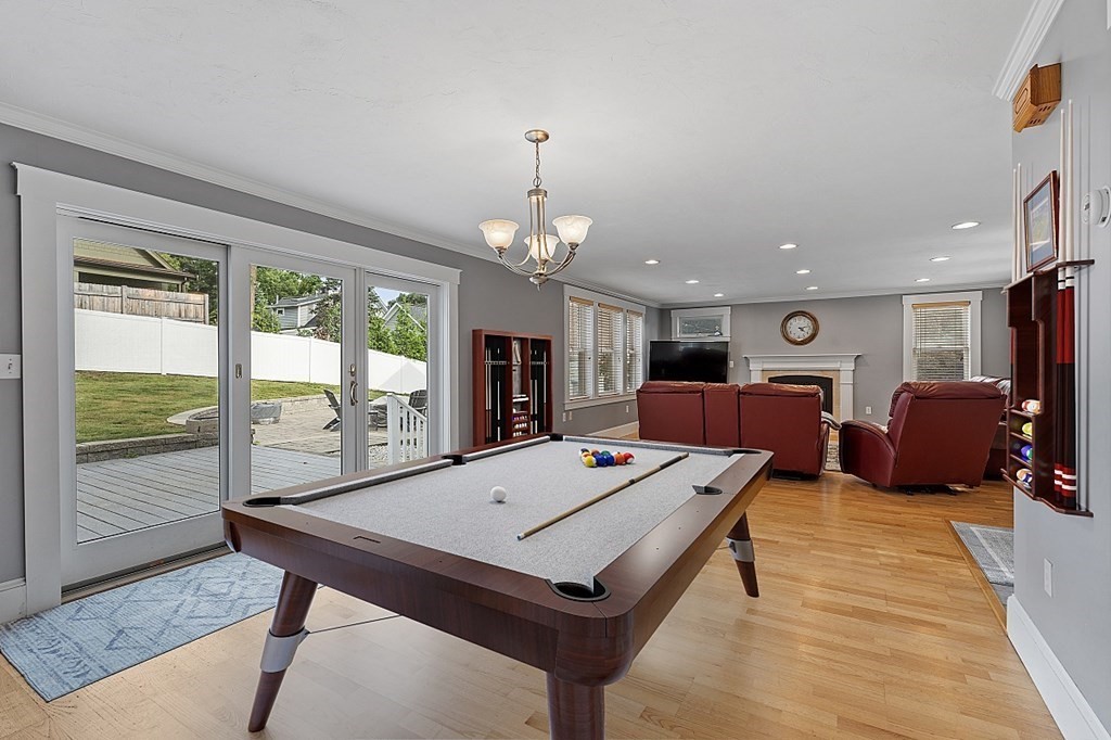 8 Perham Street Chelmsford, MA 01824 - Photo 21 of 42 a living room with hard wood floor furniture and a table