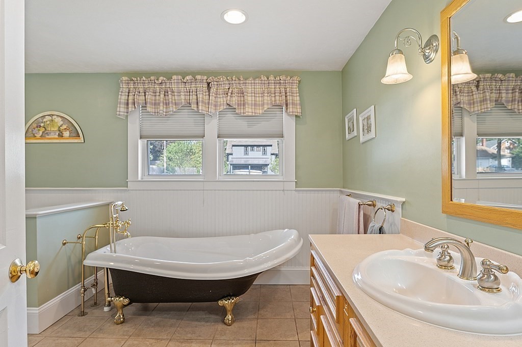 8 Perham Street Chelmsford, MA 01824 - Photo 27 of 42 a bathroom with a sink and a mirror
