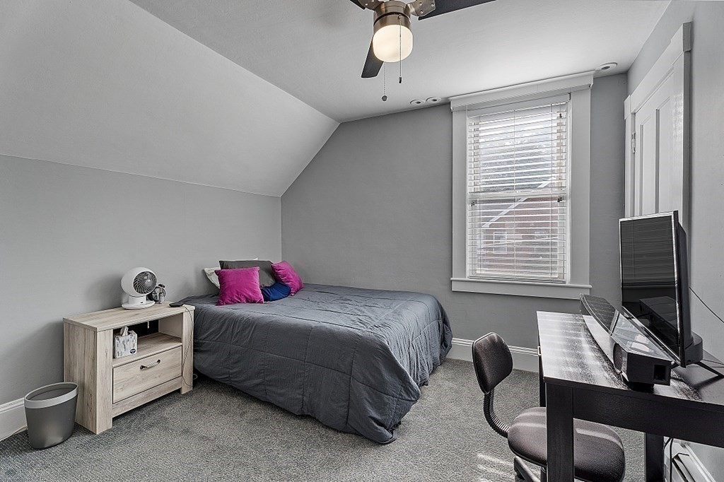 8 Perham Street Chelmsford, MA 01824 - Photo 29 of 42 a bedroom with a bed and a flat screen tv
