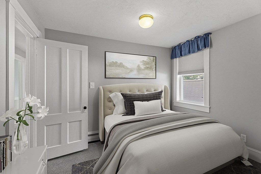 8 Perham Street Chelmsford, MA 01824 - Photo 31 of 42 a bedroom with a bed and a painting on the wall