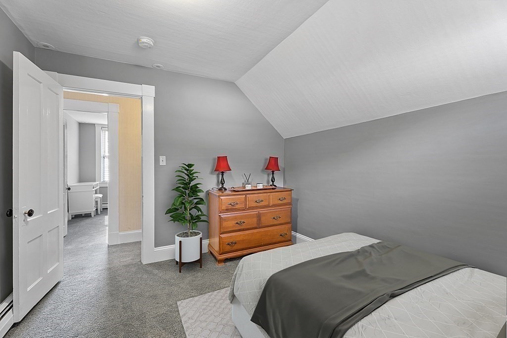 8 Perham Street Chelmsford, MA 01824 - Photo 35 of 42 a bedroom with a bed and a cabinets
