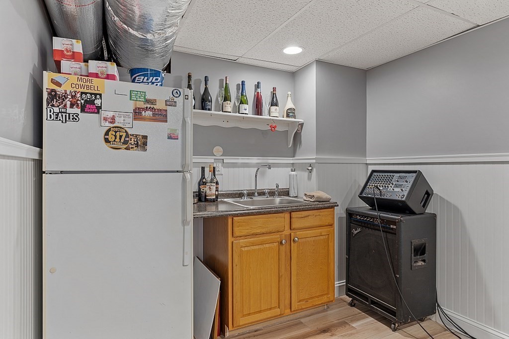 8 Perham Street Chelmsford, MA 01824 - Photo 38 of 42 a kitchen with refrigerator and stove