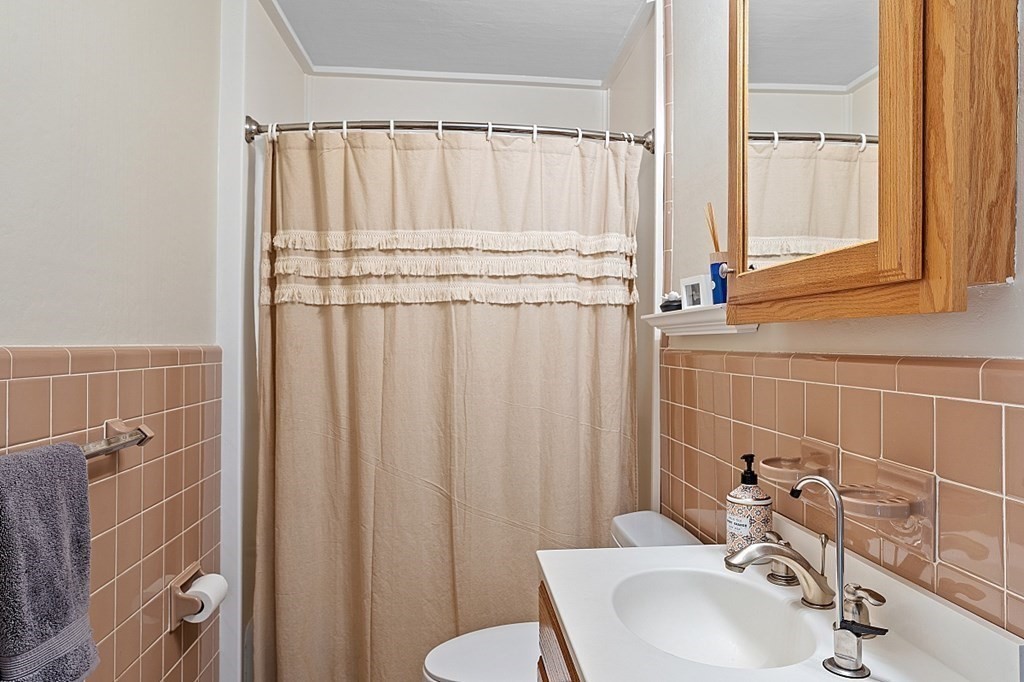 8 Perham Street Chelmsford, MA 01824 - Photo 41 of 42 a bathroom with a sink and a shower