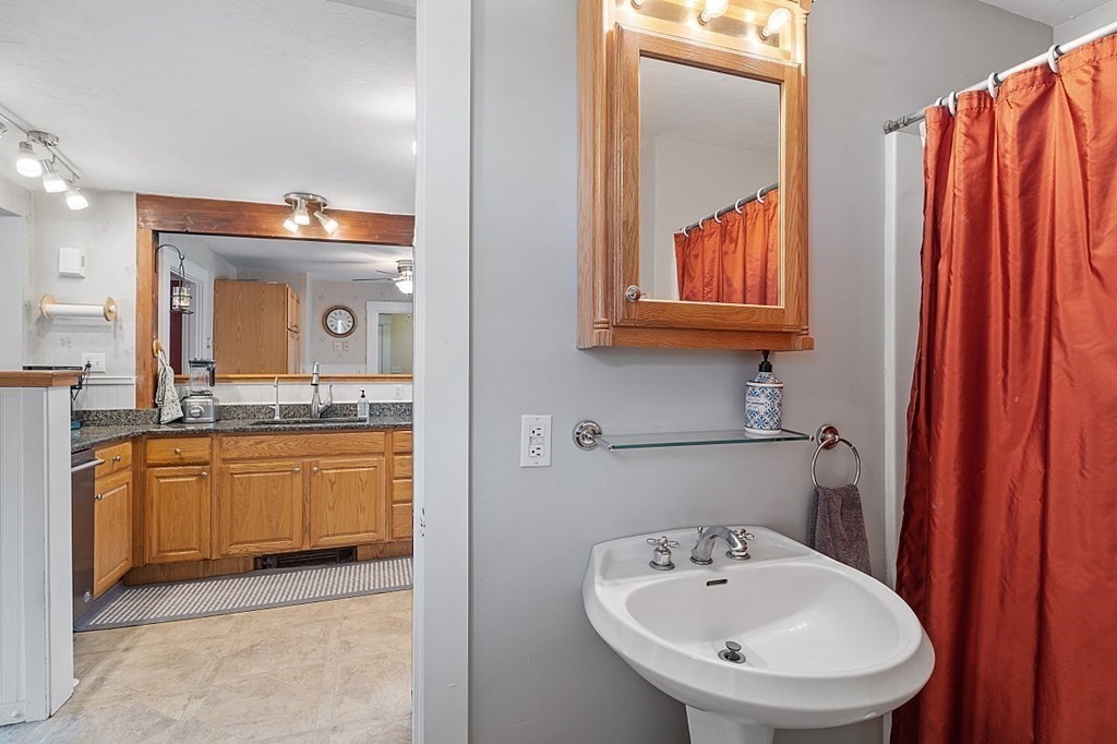 8 Perham Street Chelmsford, MA 01824 - Photo 42 of 42 a bathroom with a sink and a mirror