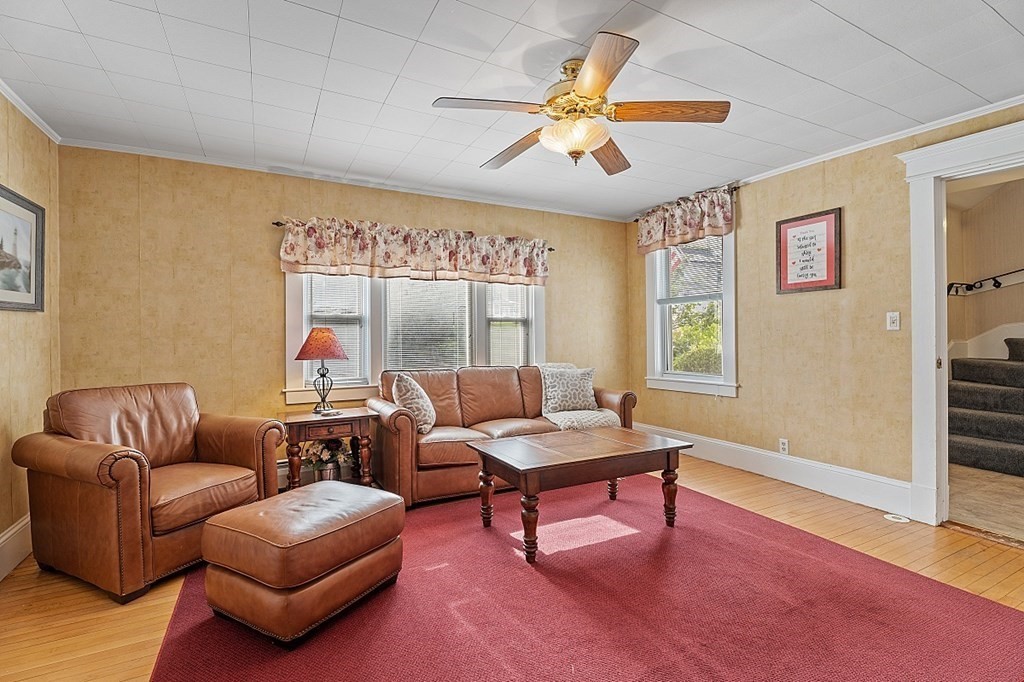 8 Perham Street Chelmsford, MA 01824 - Photo 8 of 42 a living room with furniture and a large window