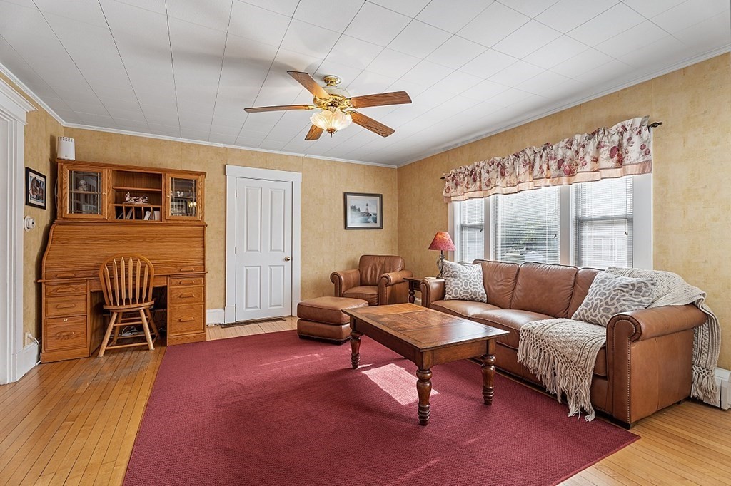 8 Perham Street Chelmsford, MA 01824 - Photo 9 of 42 a living room with furniture and a large window