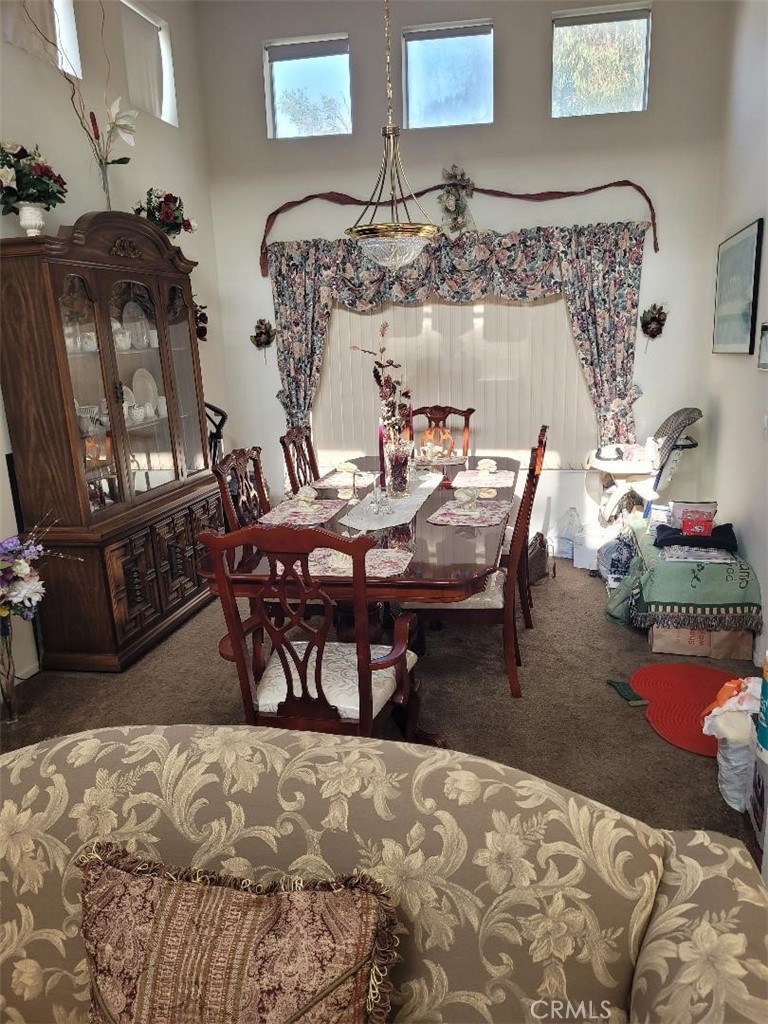 866 Homestead Road Corona, CA 92878 - Photo 11 of 15 a view of a dining room with furniture